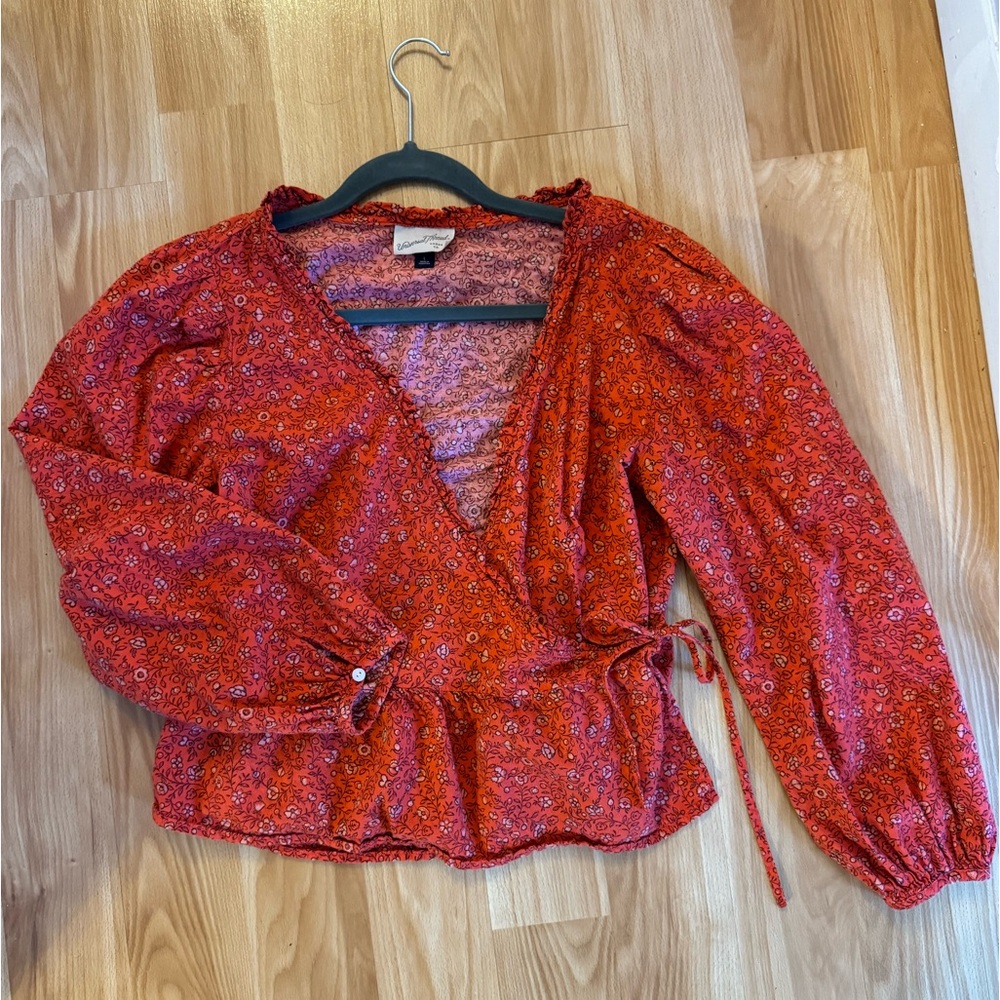 Red floral wrap blouse